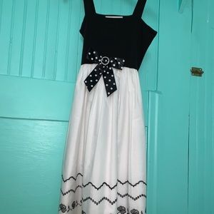 Cute black and white dress with bow and detailing!